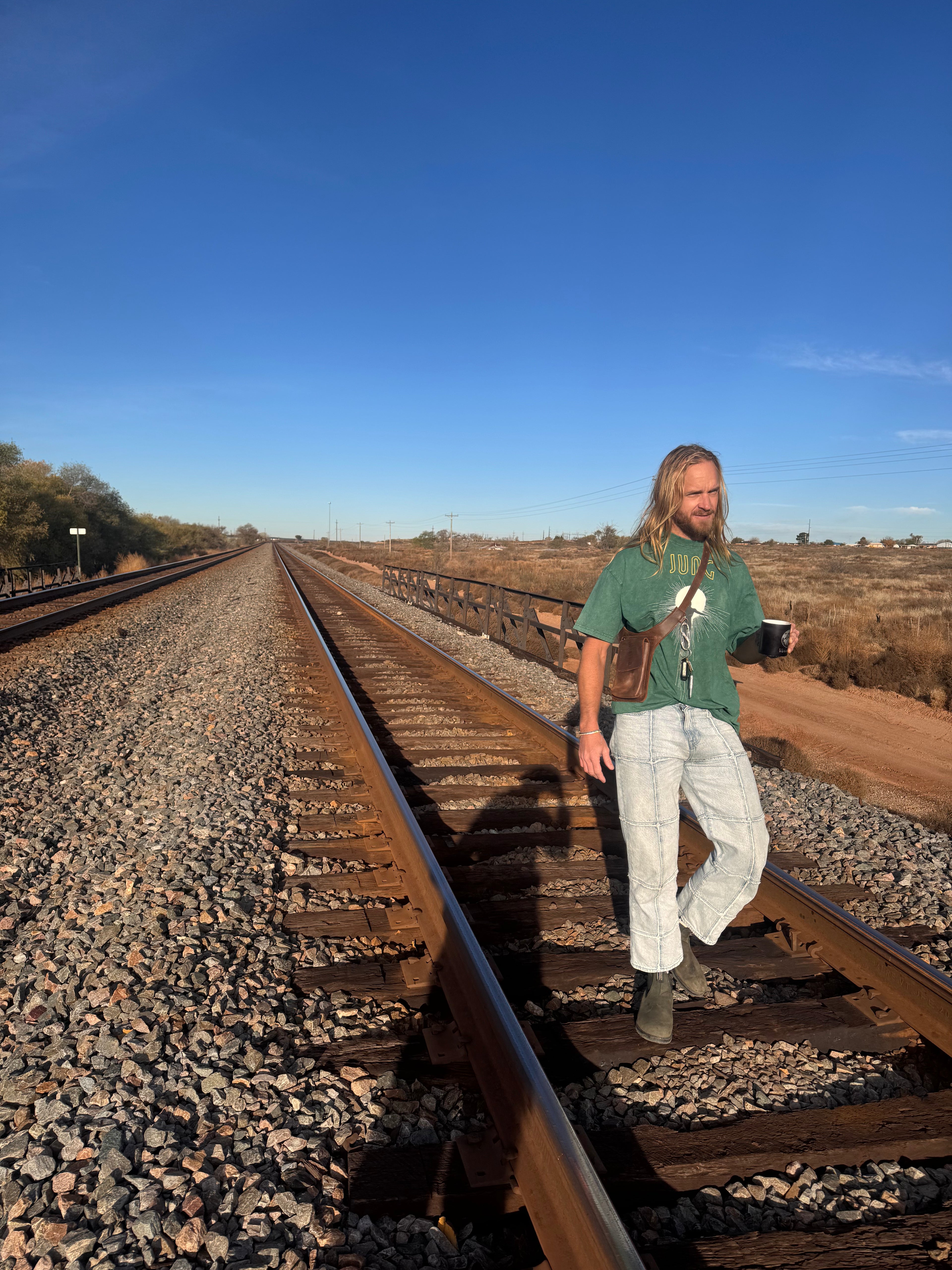 Man standing on a railway track with a clear blue sky. perfect gift for girlfriend leather fanny pack leather waist pack leather cross body bag 